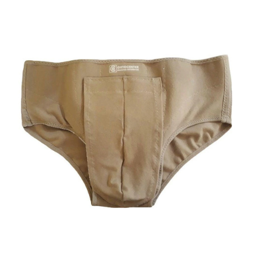 Cueca Para Hérnia Inguinal Dupla - Ortocenter Cueca para hérnia inguinal dupla Ortocenter na cor bege. A imagem mostra o design com as pelotas de poliuretano anatômicas e o fecho em velcro para ajuste.